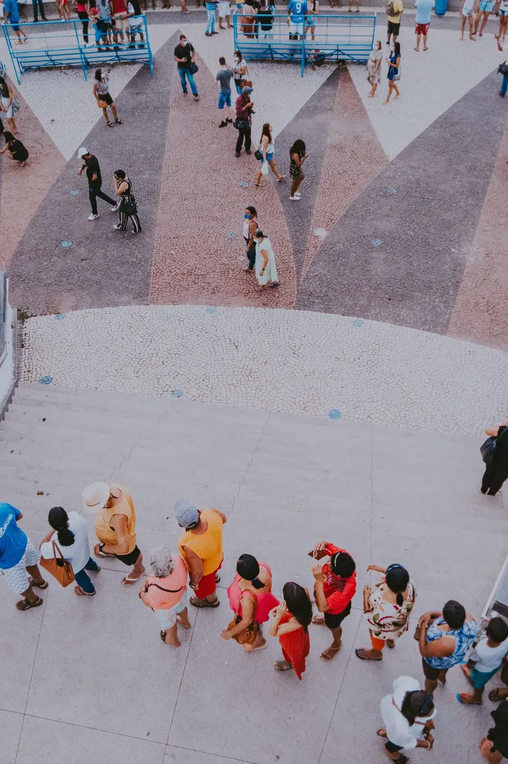 Overhead view of a large crowd of people queuing