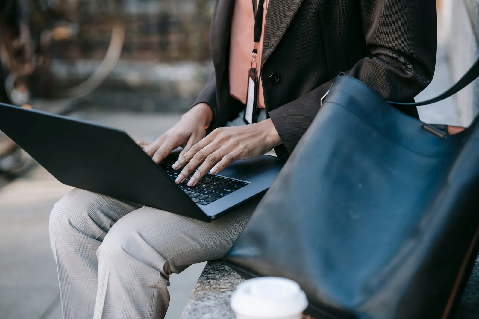 Focused professional working on a laptop — the right stack is a few complementary sources, not one replacement