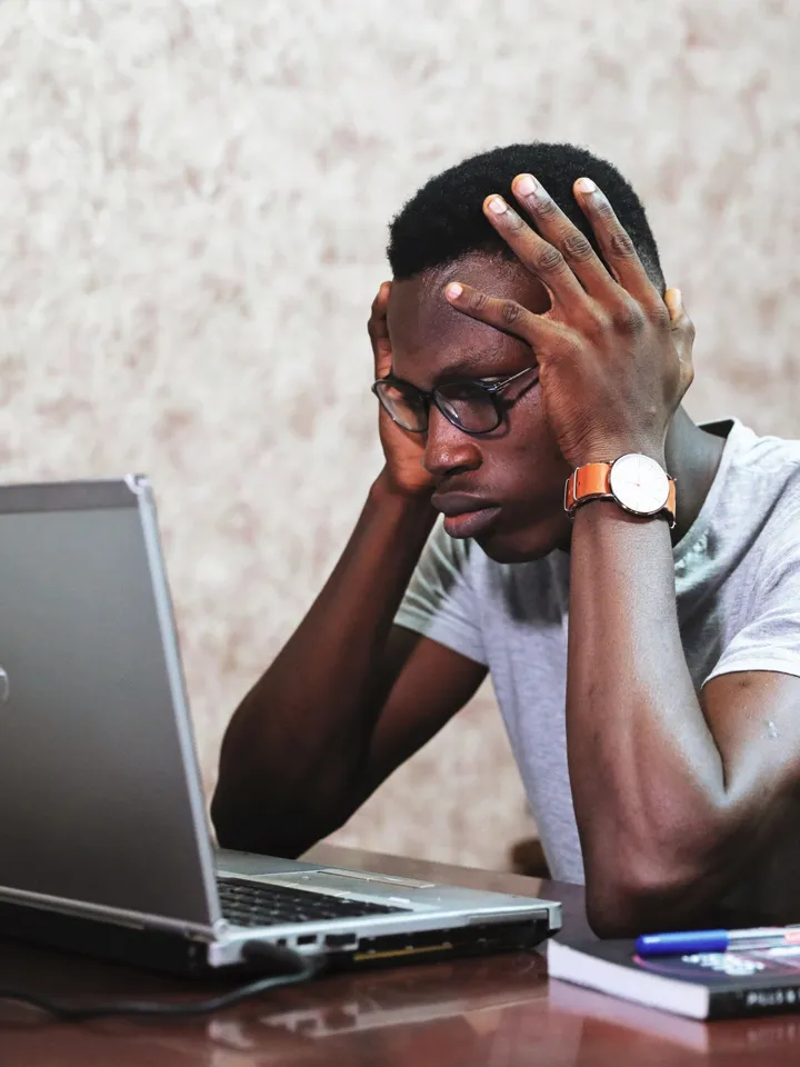 Frustrated job seeker at a laptop after receiving no reply