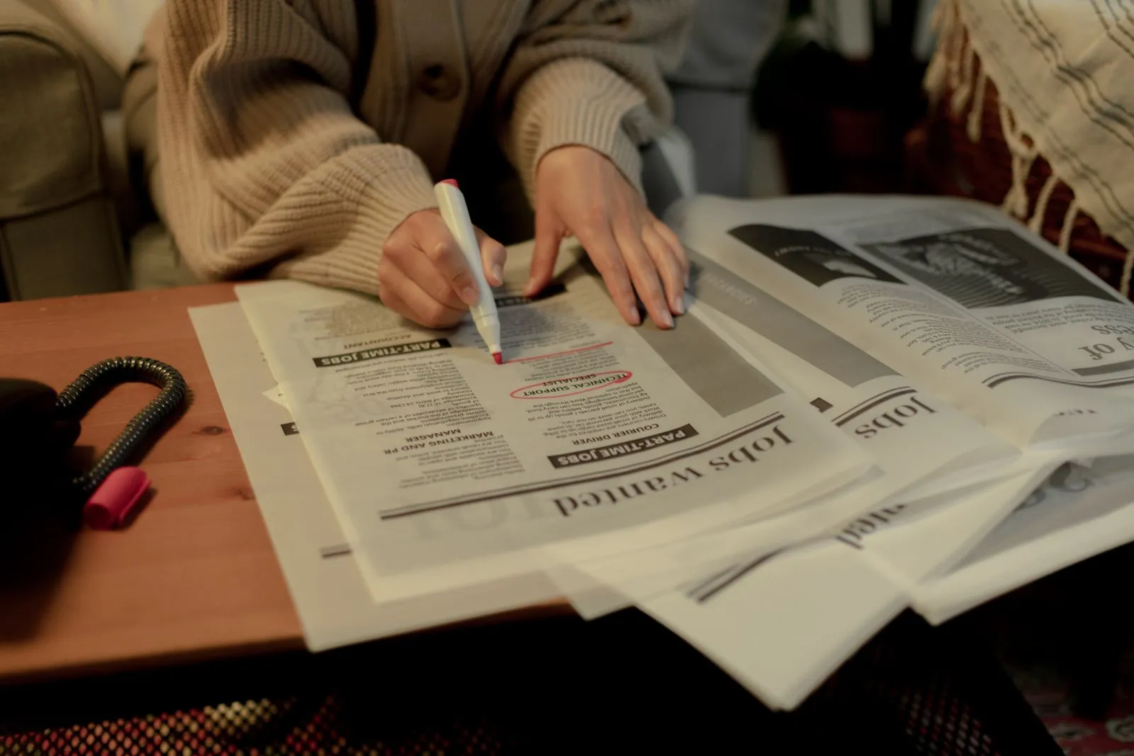 Highlighting job listings in a newspaper — checking which openings are actually real
