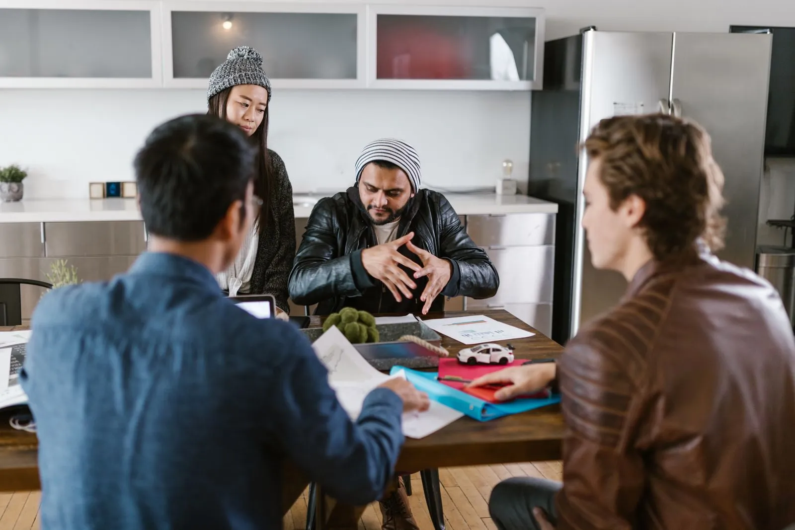 A hiring team discussing an open role in an office — where jobs exist before they are ever advertised