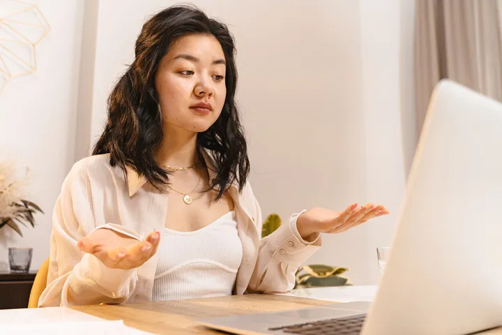 Puzzled job seeker looking at a laptop screen