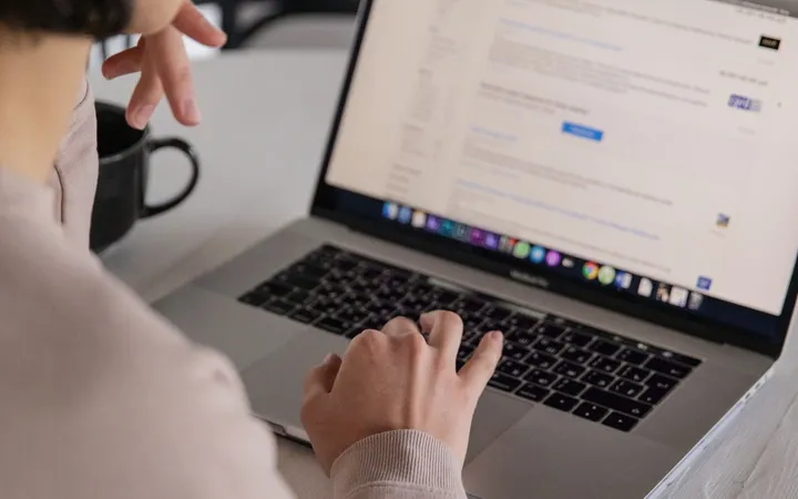 Remote worker searching for jobs on a laptop