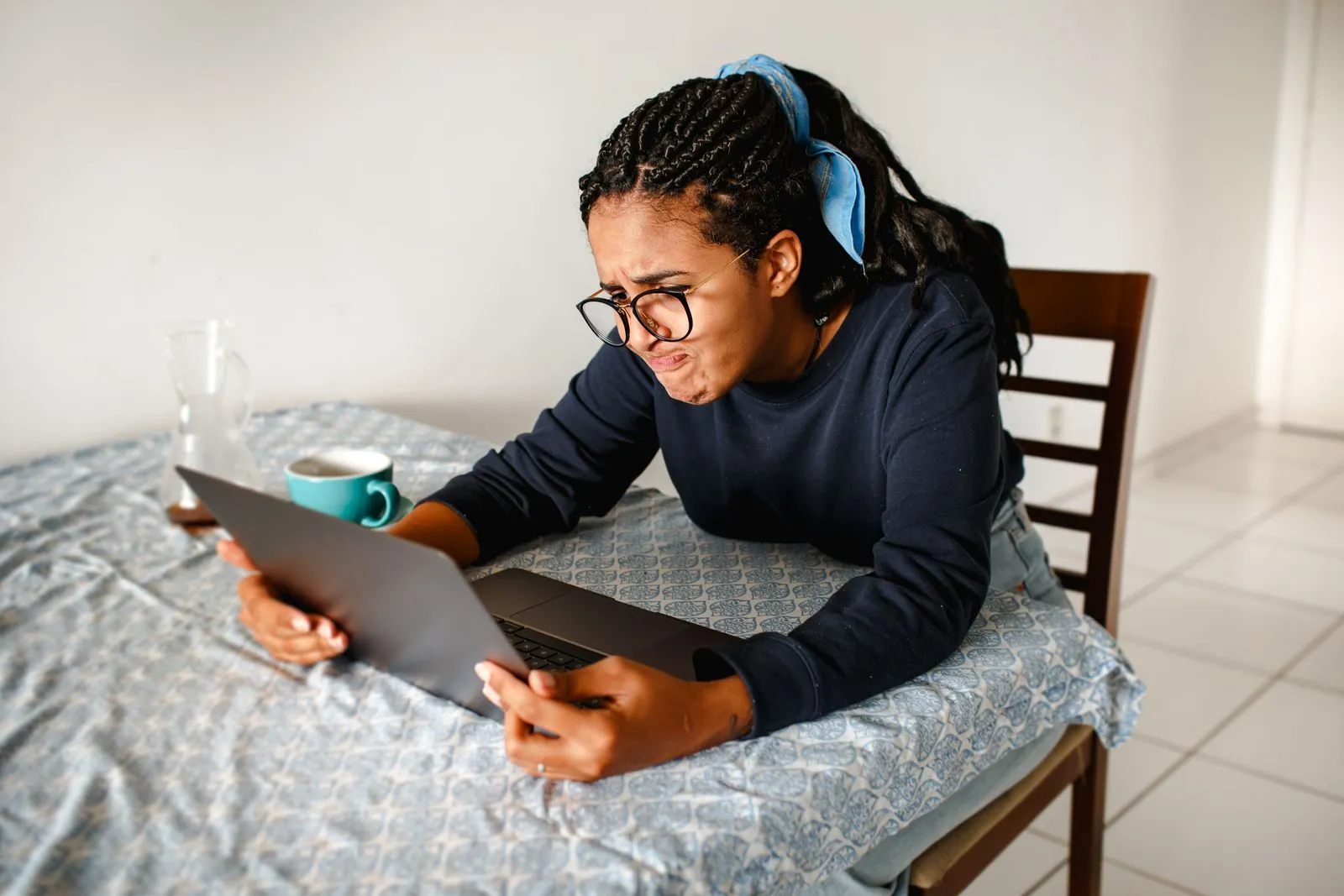 Job seeker frustrated at a laptop at home — the silence isn't a verdict on your skills